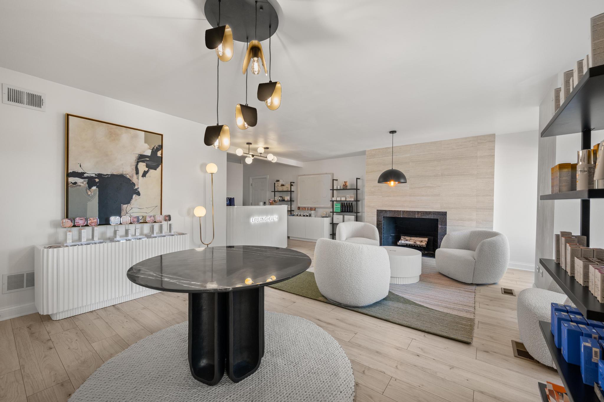 A-modern-interior-space-with-minimalist-decor-featuring-a-black-and-gold-light-fixture
